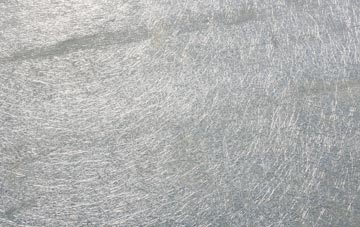 Tydd Gote laminate fibreglass or shingles?
